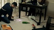CSI detectives gather evidence from a crime scene.