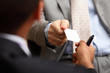 two successful business executive exchanging business card