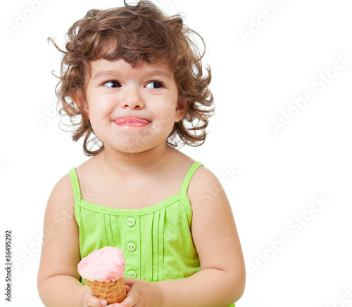 Photo: little girl with ice cream in studio isolated little girl with ice cream in studio isolated