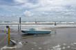 green boat at ebb tide