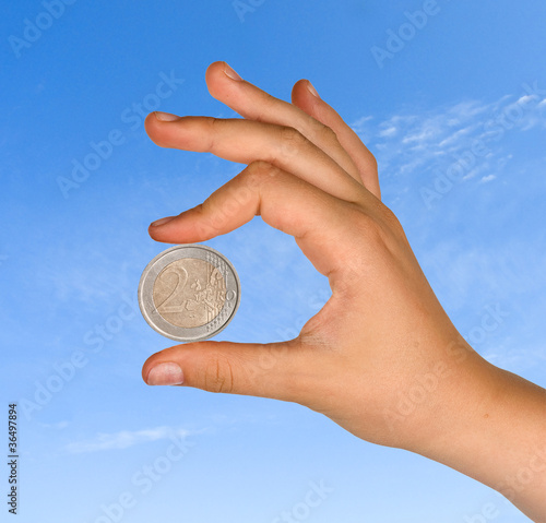 Photo: Two euro in hand Two euro in hand