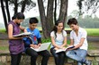 Indian Students doing group study outside college campus.