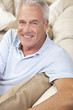 Photo: Happy Handsome Senior Man Smiling at Home Happy Handsome Senior Man Smiling at Home