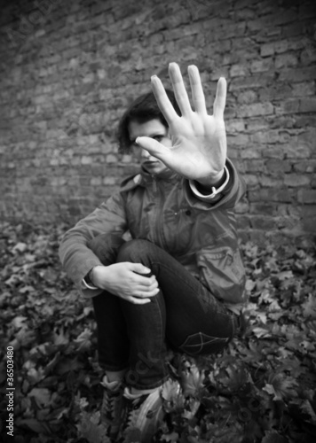 Photo: young woman making stop gesture young woman making stop gesture