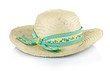 a straw hat with a green ribbon