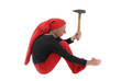 Elf working with a big hammer isolated on white