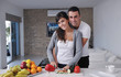 young couple have fun in modern kitchen