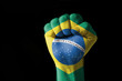 Fist painted in colors of brazil flag Fist painted in colors of brazil flag
