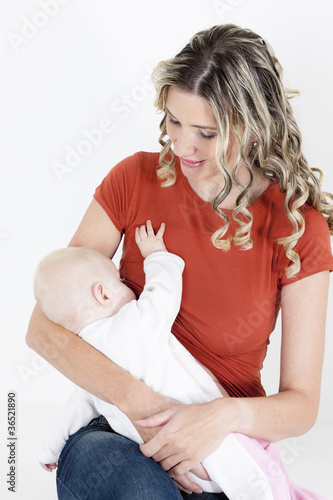 Photo: portrait of mother nursing her baby portrait of mother nursing her baby