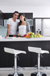 Photo: young couple have fun in modern kitchen young couple have fun in modern kitchen