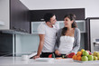 Photo: young couple have fun in modern kitchen young couple have fun in modern kitchen