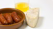 Sausage, cheese and cider out of focus