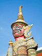The Red Giant Statue , Blue Sky on the Background The Red Giant Statue , Blue Sky on the Background