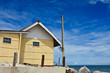 House on beach and blue sky