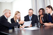 Team of businesspeople working together discussing
