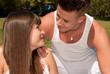young couple happy sitting on grass, love relationship