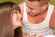 young couple happy sitting on grass, love relationship