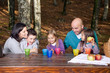 Photo: Happy family having fun outside in autumn Happy family having fun outside in autumn