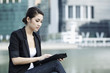 Photo: Business woman using an iPad Business woman using an iPad