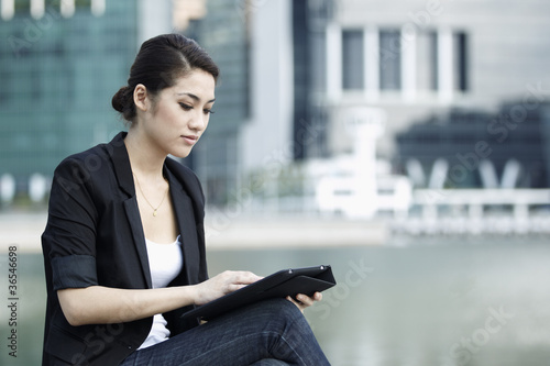 Photo: Business woman using an iPad Business woman using an iPad