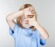 boy looking through finger frame