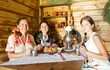 Women near  traditional  samovar