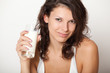 young woman holding glass of milk