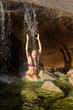 Woman swimming in a natural pool.