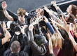 Celebrity waving to paparazzi and fans