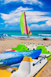 Colorful kayaks, pedalos and catamaran on a cuban beach