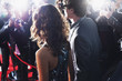 Celebrities posing for paparazzi on red carpet