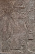 Assyrian clay relief depicting an eagle-faced god