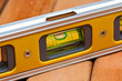Spirit level over wooden boards