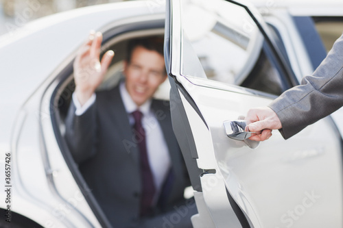 Photo: Politician emerging from limo Politician emerging from limo