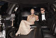Photo : Couple drinking champagne in limo Couple drinking champagne in limo