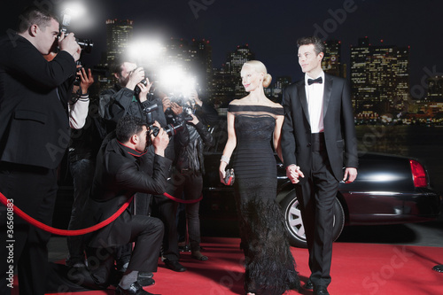Photo: Celebrities posing for paparazzi on red carpet Celebrities posing for paparazzi on red carpet