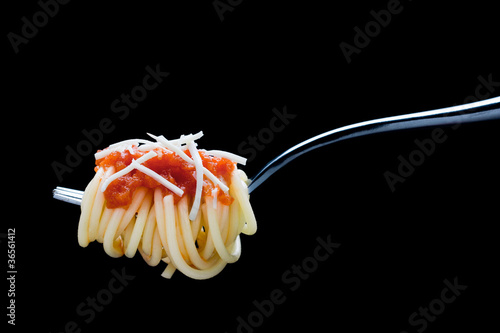 Photo: Fork with spaghetti, tomato sauce and cheese Fork with spaghetti, tomato sauce and cheese
