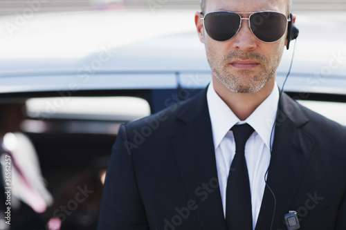 Photo: Bodyguard wearing earpiece Bodyguard wearing earpiece