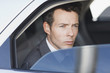 Politician peering out car window