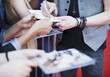 Celebrity signing autographs on red carpet