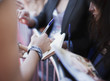 Celebrity signing autographs for fan