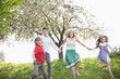 Family holding hands in park