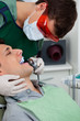 Dentist working on tooth at dental clinic