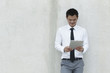 Asian Business man using a Digital Tablet