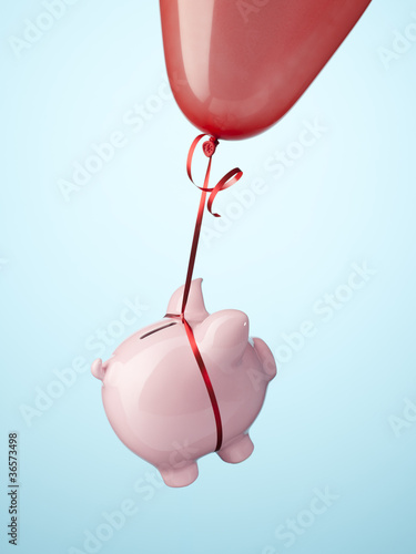 Photo: Piggy bank tied to balloon Piggy bank tied to balloon