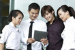 Asian Business people using Touch-pad PC