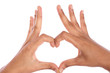 Woman hands making heart sign isolated on white
