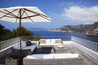Sofas on patio overlooking skyline
