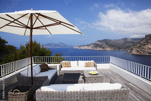 Photo: Sofas on patio overlooking skyline Sofas on patio overlooking skyline
