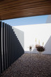 Metal gate in modern courtyard